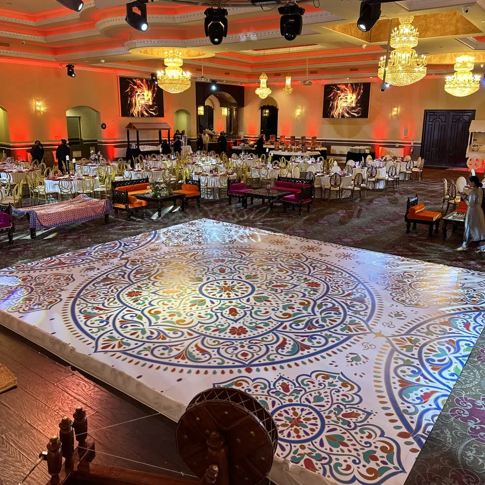 Mandala-pattern vinyl dance floor in a decorated banquet hall