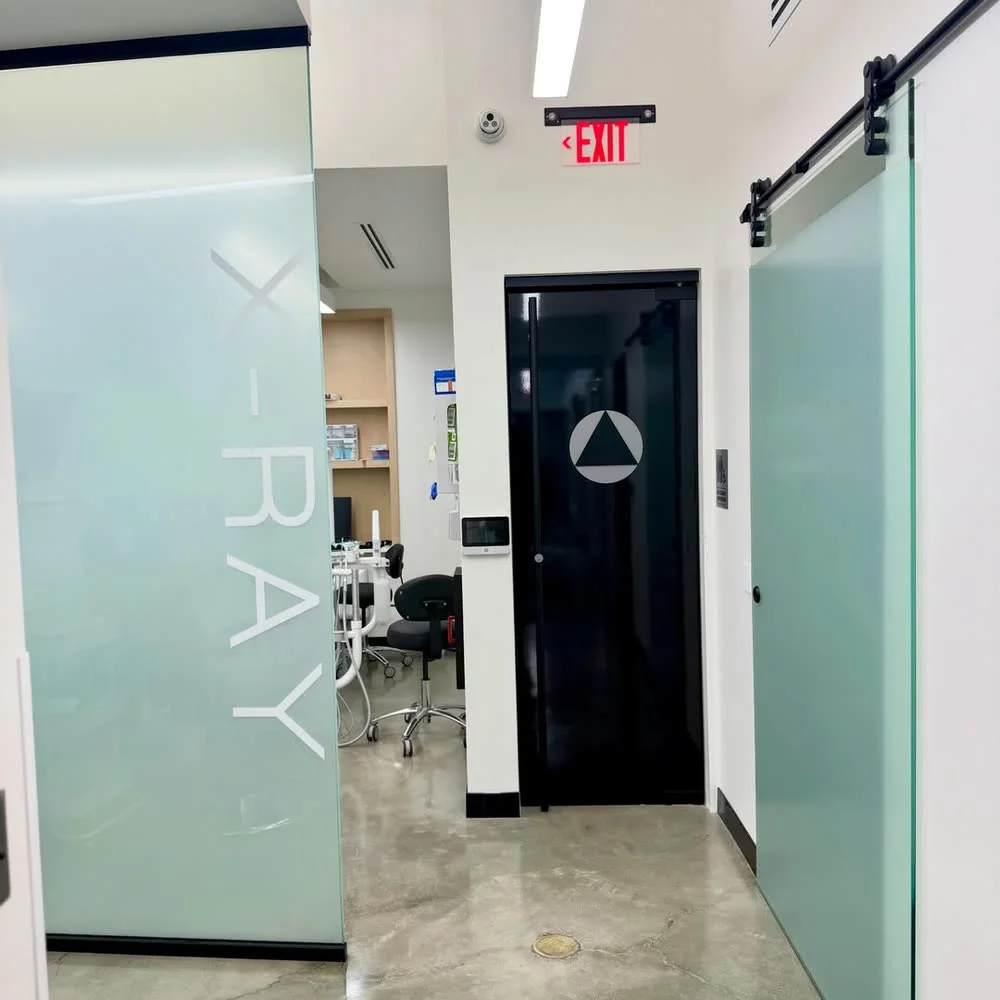 Frosted vinyl X-RAY lettering on an office glass wall